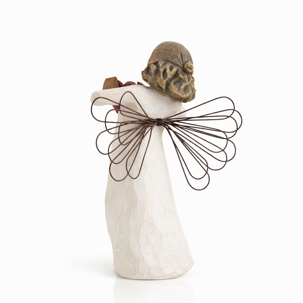 With Love Angel figurine holding a red heart as a heartfelt love gift